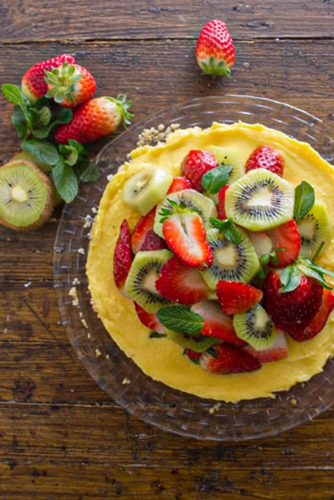 Fruit tart on a glass dish.
