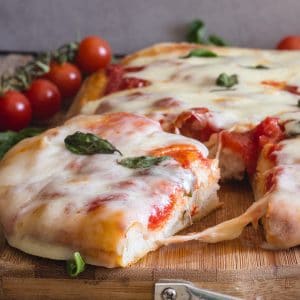 a slice cut of no knead pizza dough Pizza Margherita