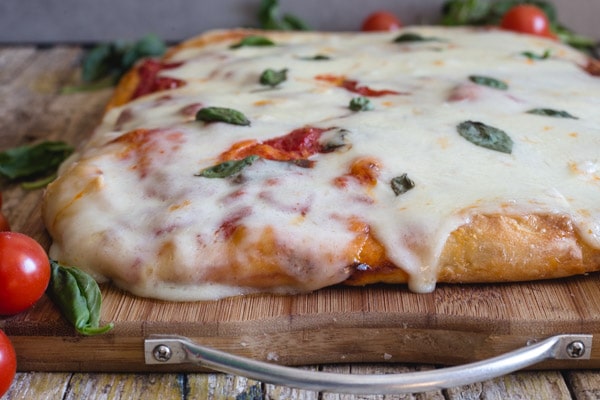 pizza Margherita on a wooden board