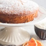 orange cake on a white cake stand