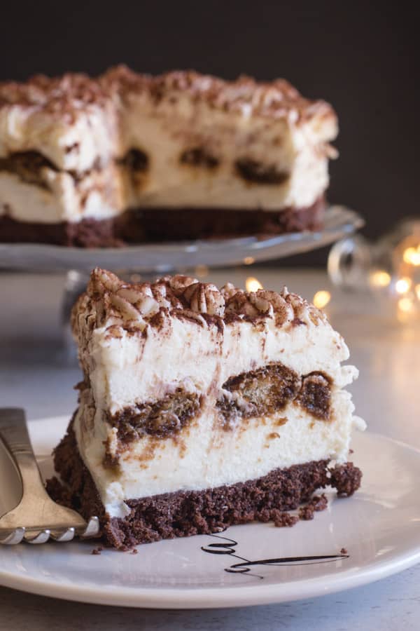 tiramisu cheesecake with a slice on a plate