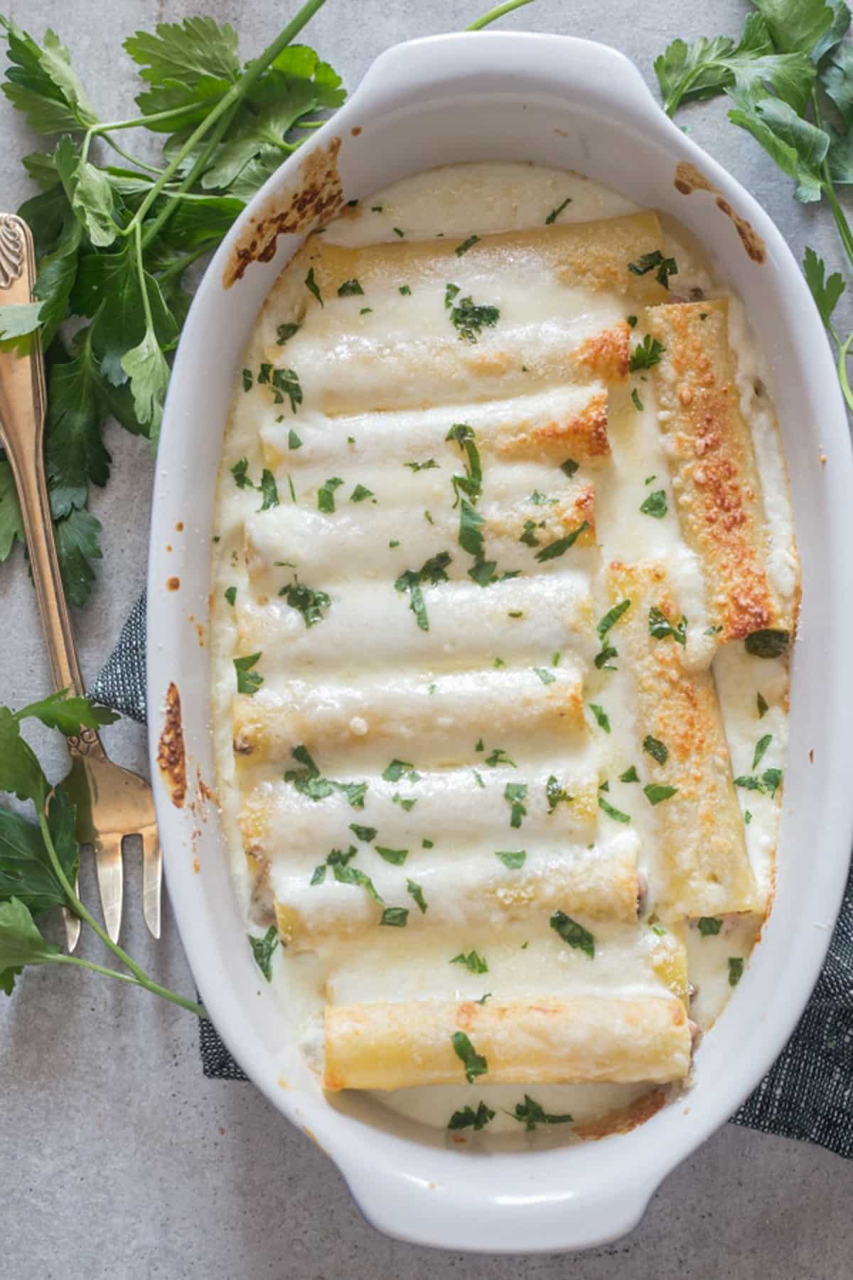 Cannelloni in a white pan.