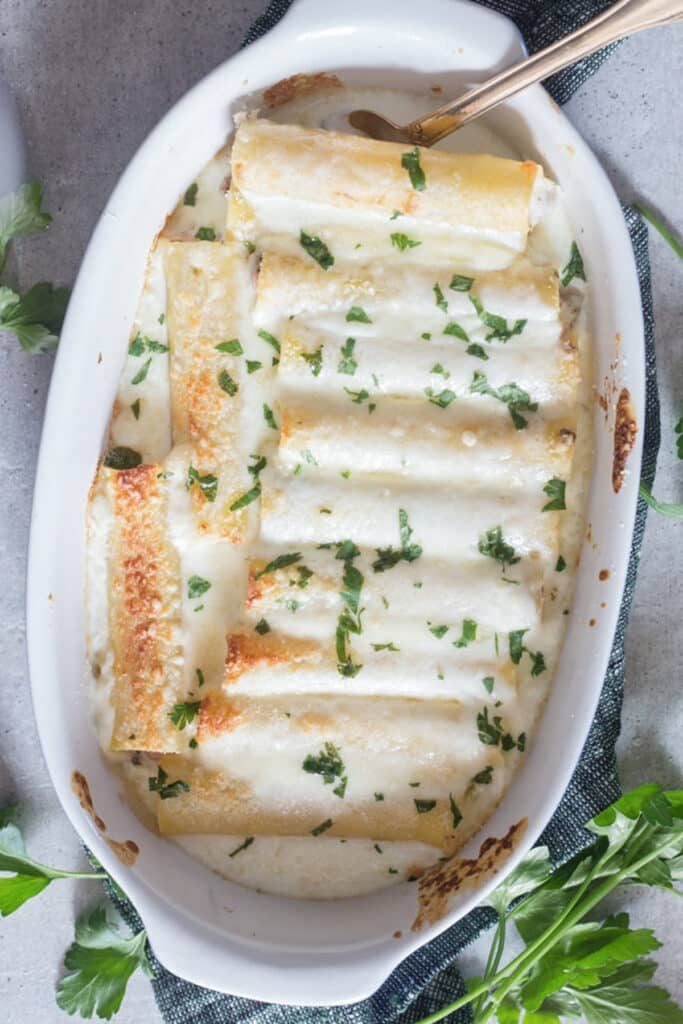 Cannelloni in a white pan.