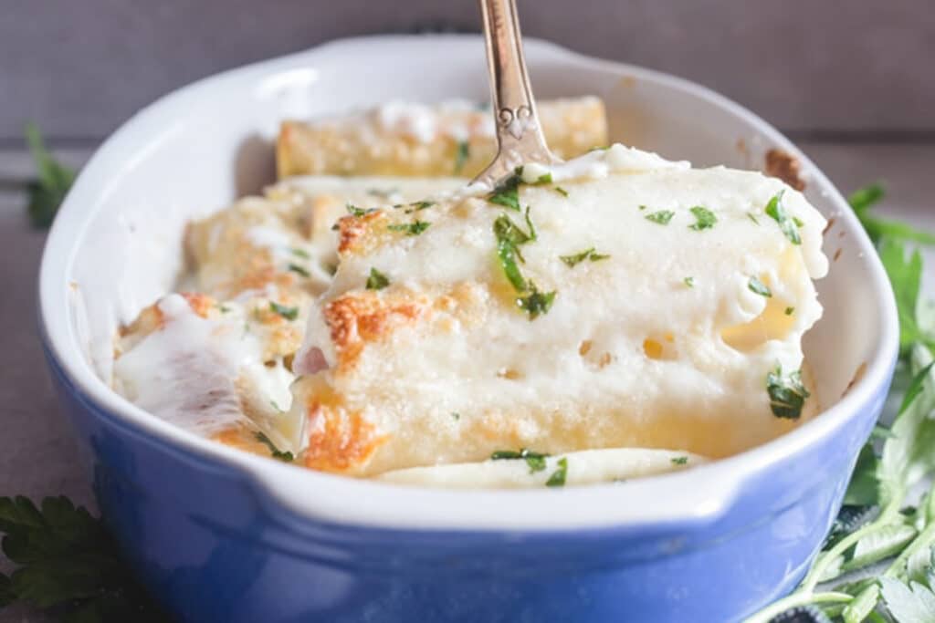 Three cannelloni on a fork.