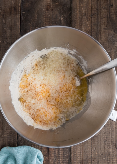 Adding the water, egg and cheese.