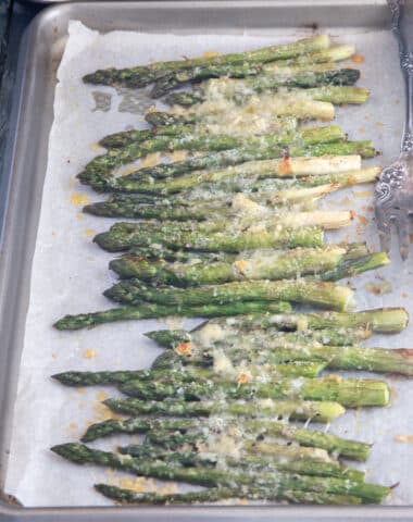 Asparagus on a baking sheet.
