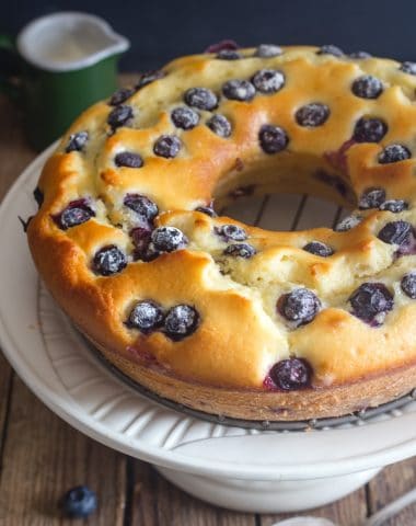 blueberry cake on a white stand