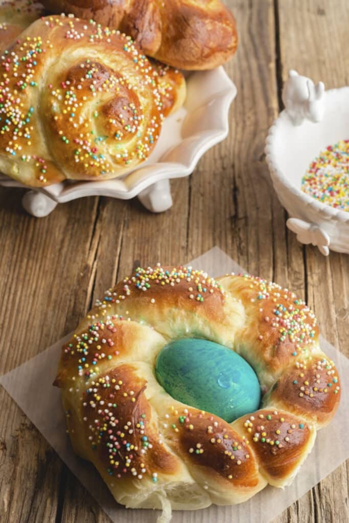 Italian Easter bread on paper and in a white dish.