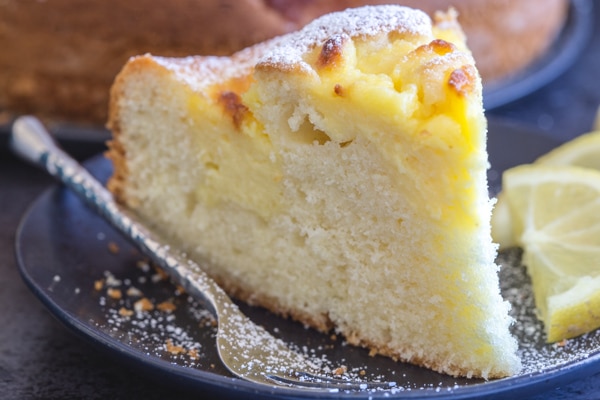 up close slice of Italian pastry cream filled lemon cake.