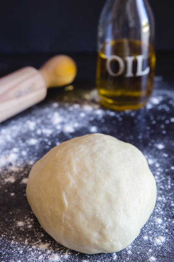 savory crust dough on a black board
