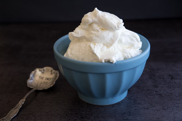 stabilized whipped cream in a blue bowl