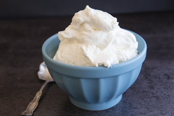 stabilized whipped cream in a blue bowl