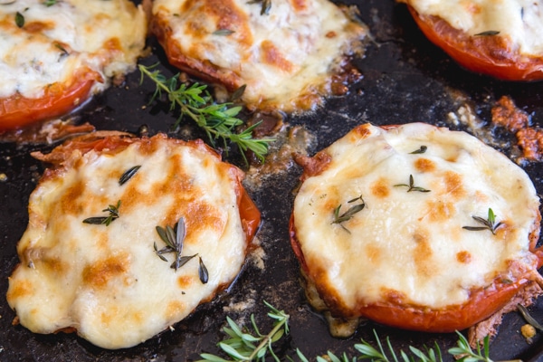 baked tomatoes on a black pan