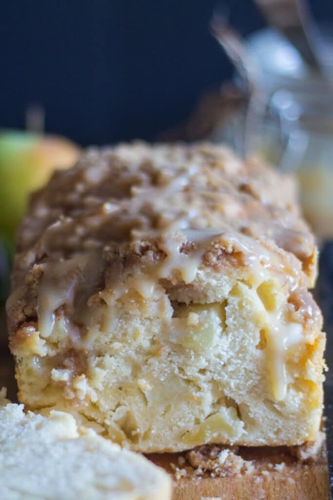 Apple bread with one slice cut.