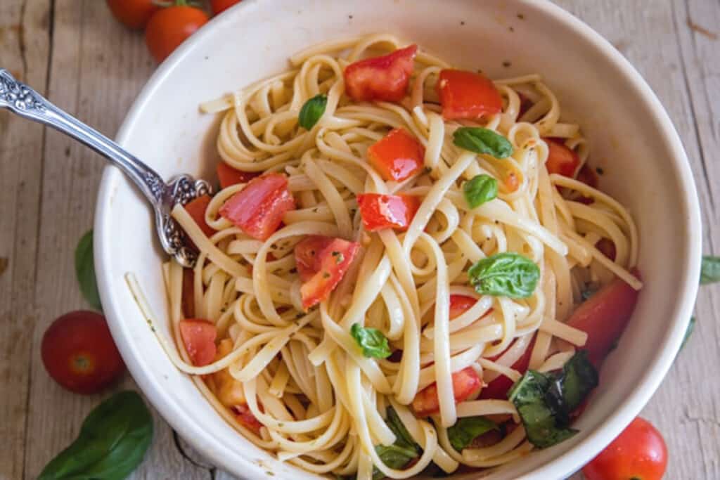 Pasta alla checca in a white bowl.