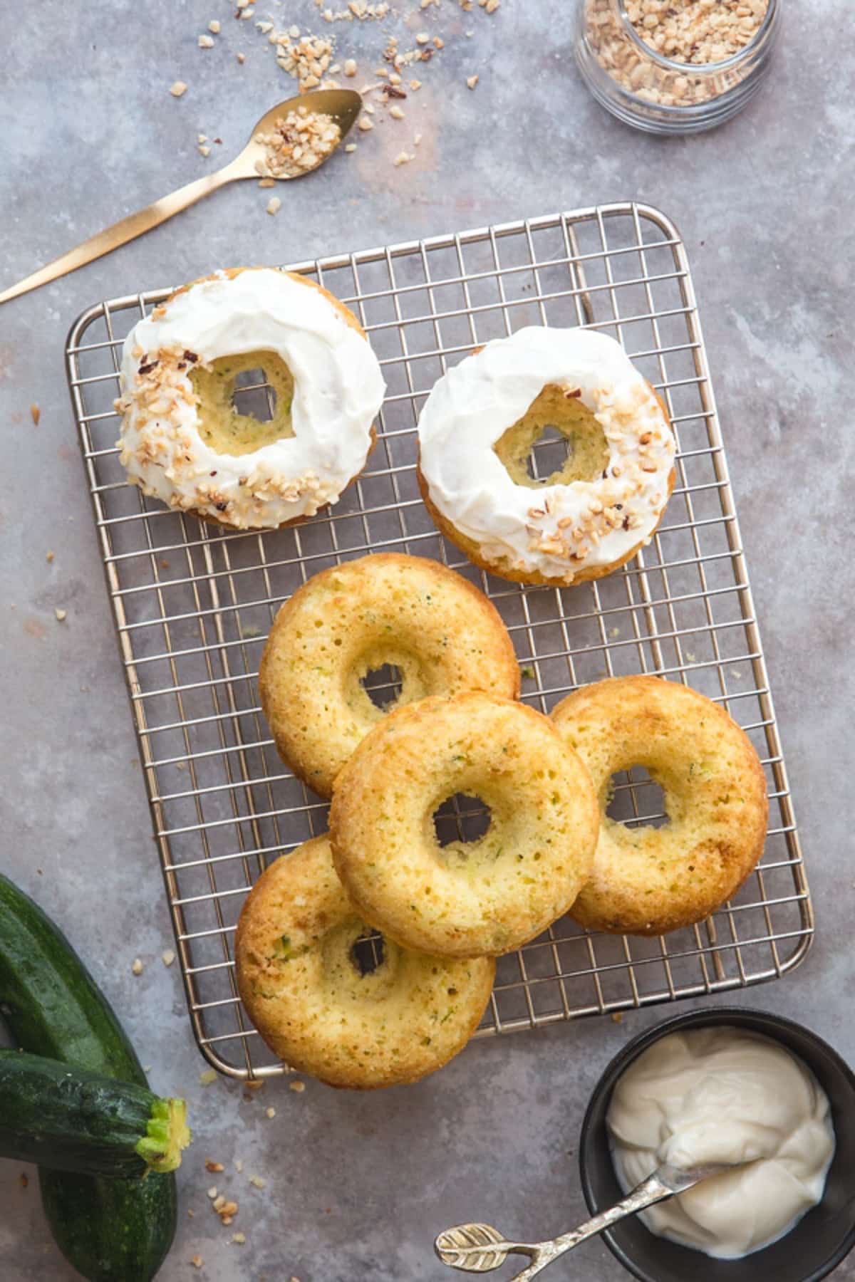 Zucchini donuts on a wire rack.