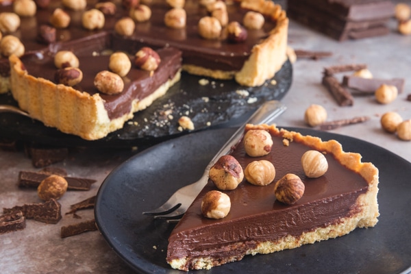 chocolate pie slice on a black plate