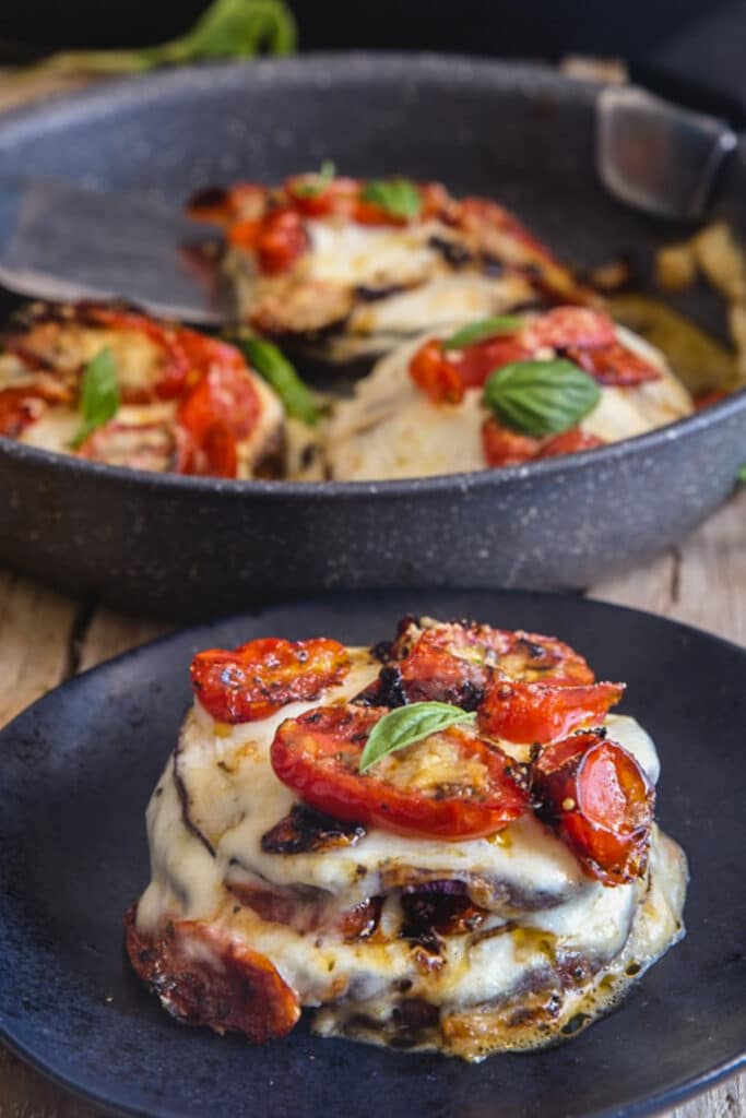 Stacks in a black pan with one on a black plate.