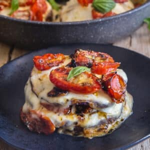 Stacks in a black pan with one on a black plate.