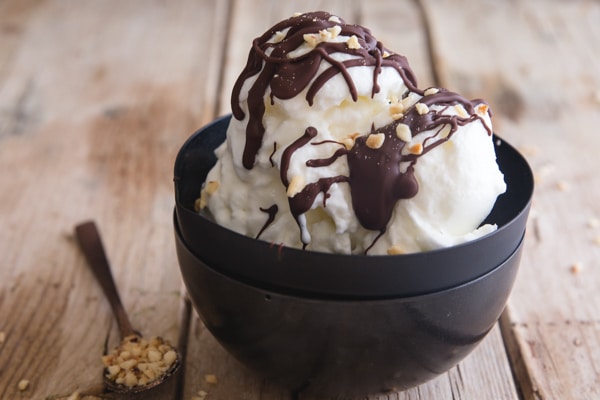 fior di latte drizzle with chocolate in a black bowl