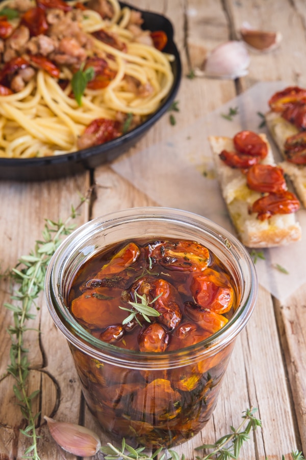 roasted tomatoes in a jar with oil, toss with pasta in a pan on on a slice of bread