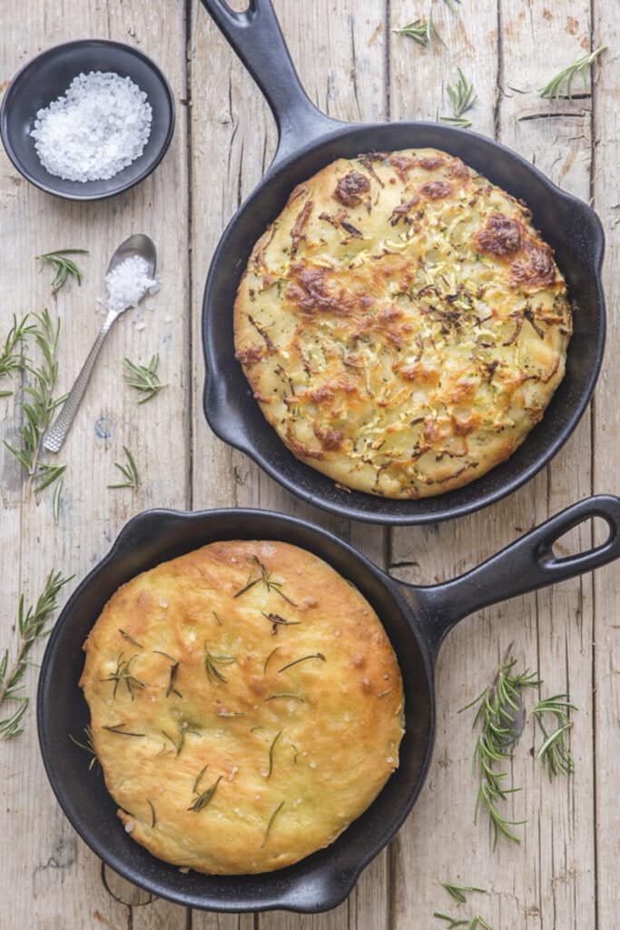 Potato focaccia bread on a wooden board.