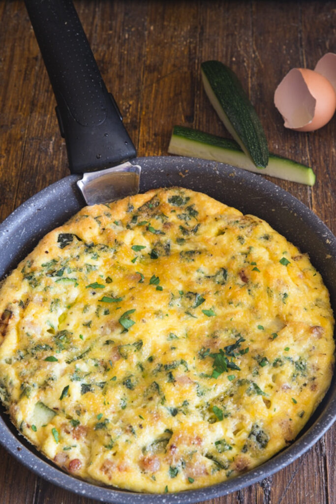 Frittata in a black pan.