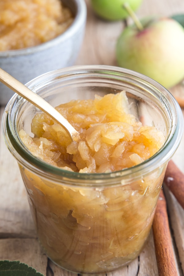 chunky homemade applesauce in a glass container