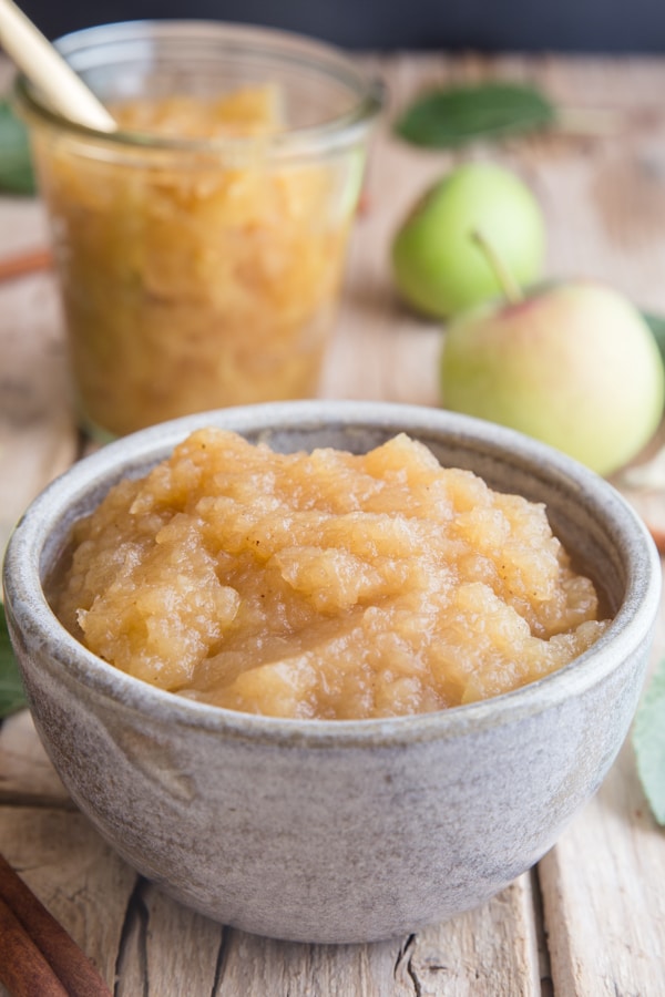 homemade applesauce in a bowl and a glass