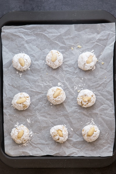 almond cookies on a prepared cookie sheet ready for baking