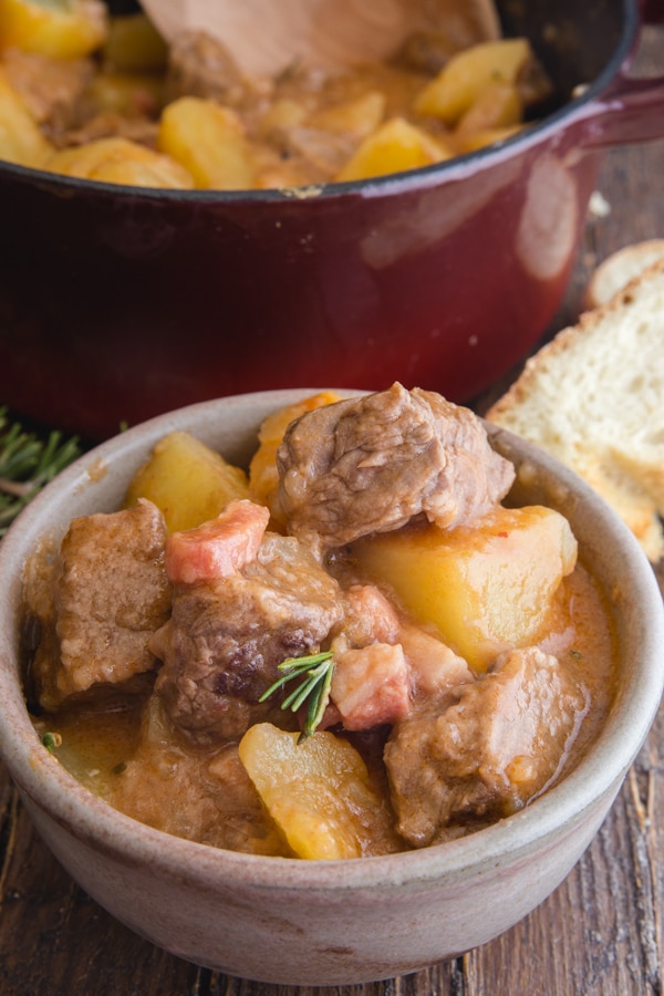 beef and potato stew in a white bowl