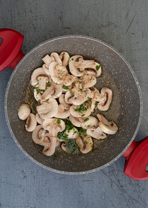 Cooking the mushrooms in the pan.