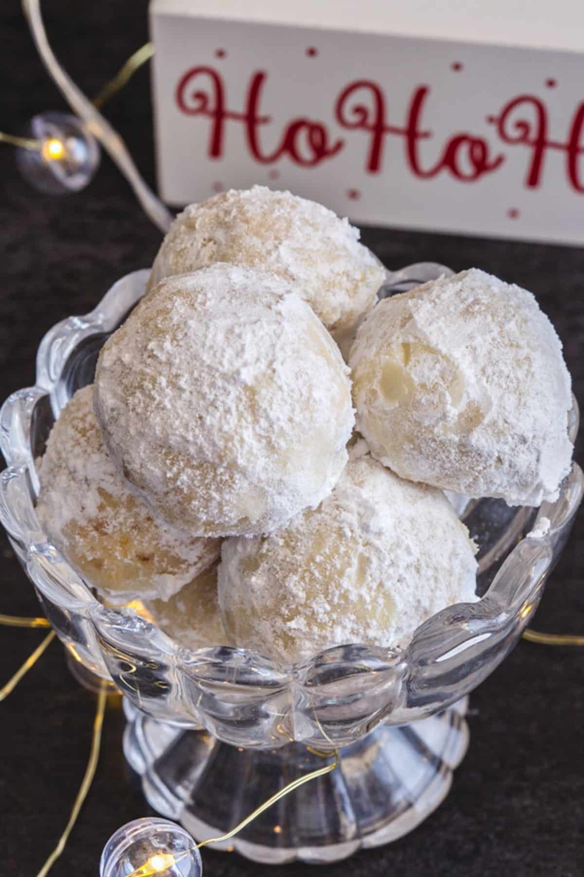 Snowball cookies in a glass bowl.