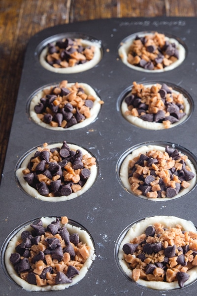 cookie cups filled with toffee bits and mini chocolate chips