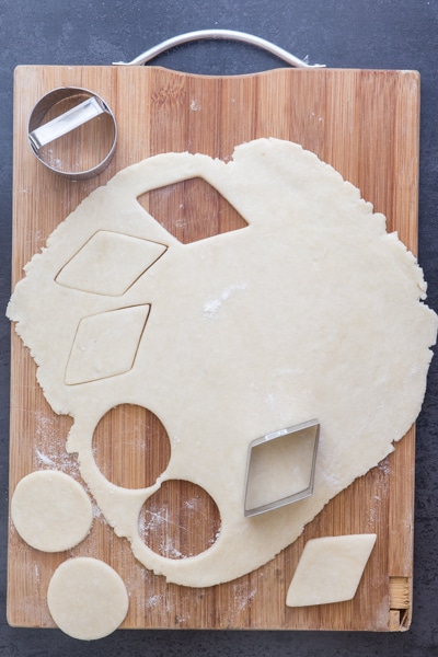 cutting out the flaky pie crust to make cookies
