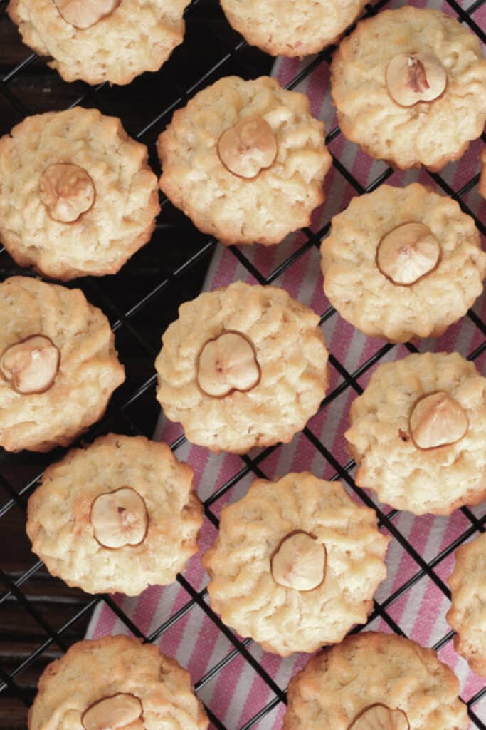 Hazelnut cookies on a wire rack.