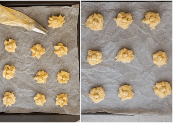 The cookies before baking on a baking sheet with and without a hazelnut.