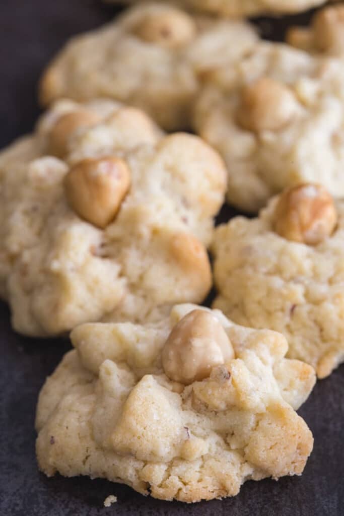 Hazelnut cookies on a black board.