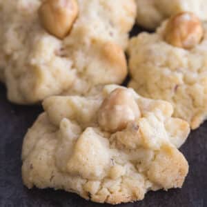 Hazelnut cookies on a black board.