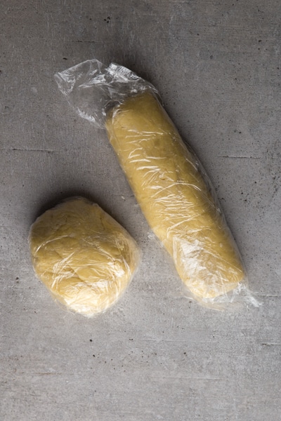 forming the dough into a ball and a log and wrapping in plastic