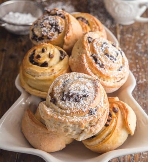 Sweet buns in a white dish.