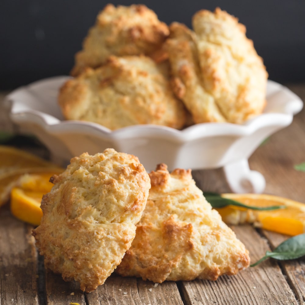 drop biscuits on a white plate and 2 on a wooden board