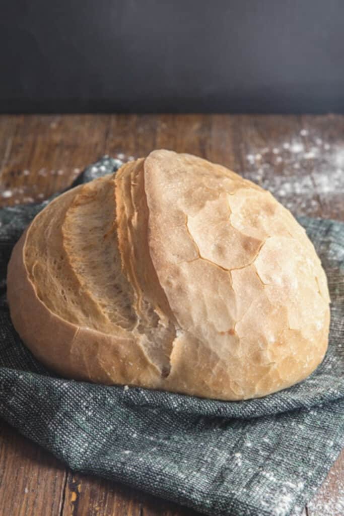 Italian bread on a blue cloth.