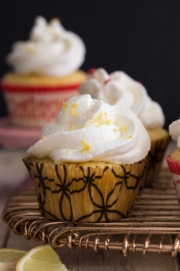 lemon cupcakes in a brown and black cupcake holder