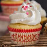 Lemon cupcake on a wire rack.