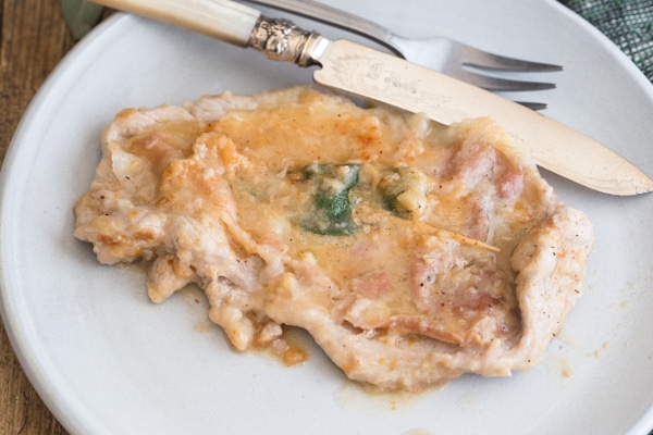 saltimbocca on a plate with a knife and fork 