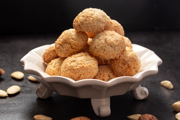 amaretti cookies on a white cake plate