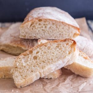 bread and slices on a parchment paper