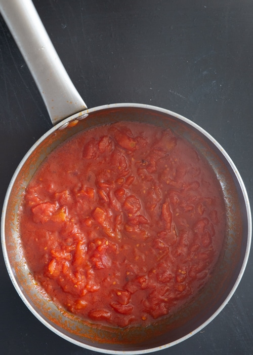 The tomatoes cooked in the pan.