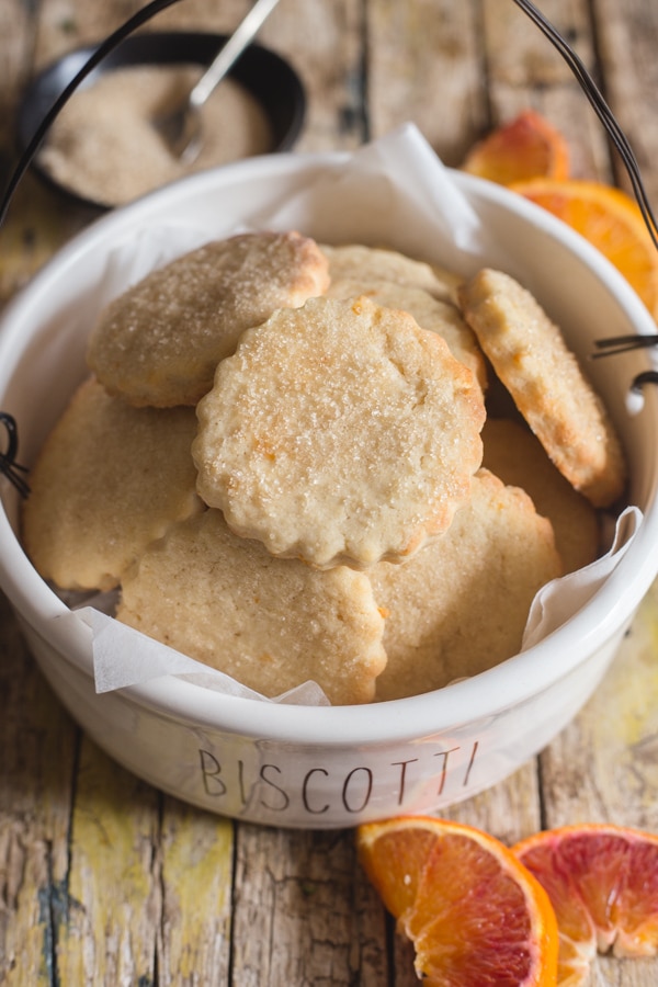 orange cookies in a white cookie bowl